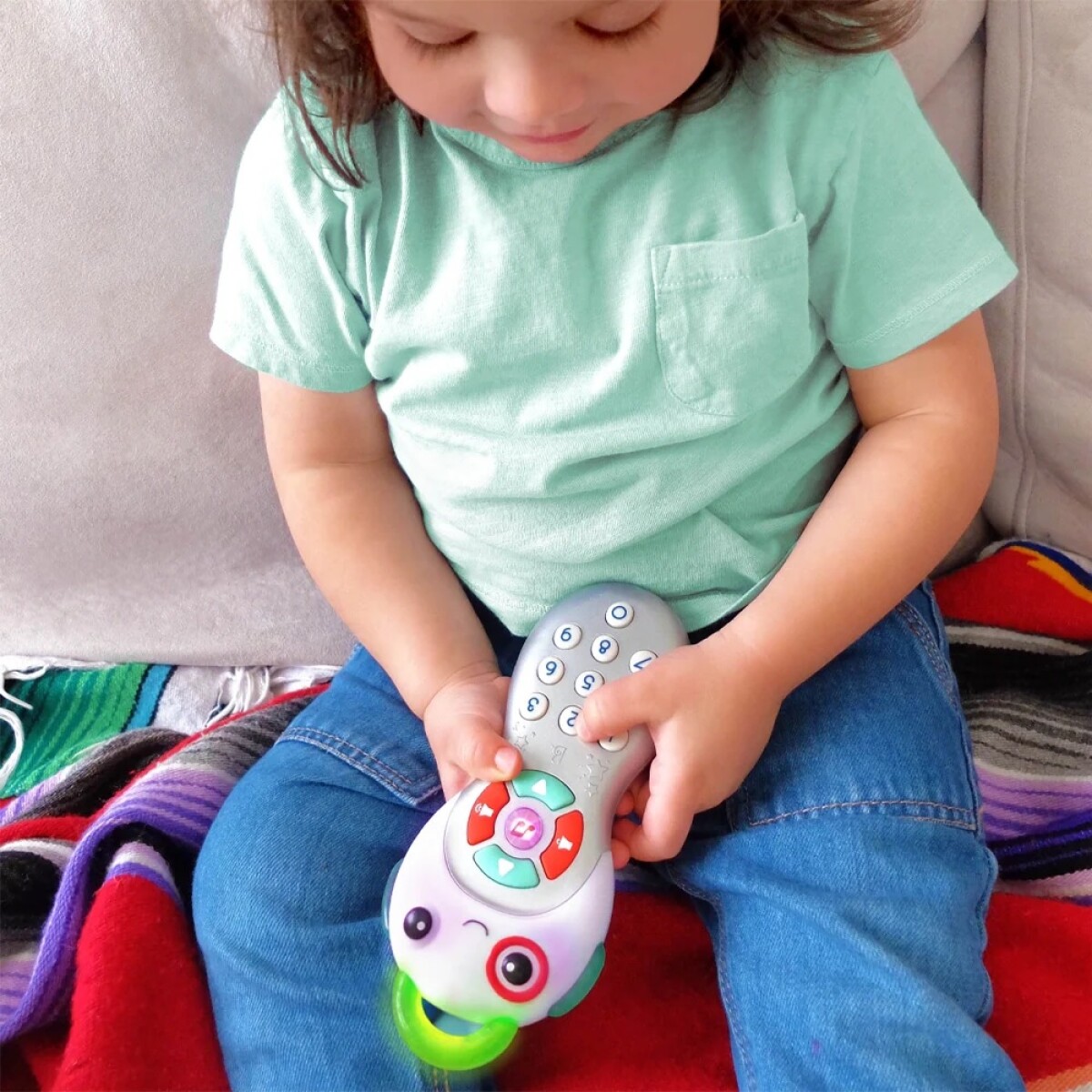 Control remoto musical con luz y mordillo 