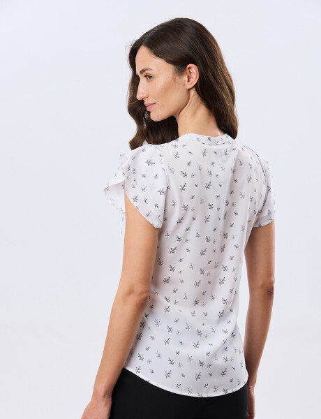 BLUSA CON VOLADOS Hojas Negra