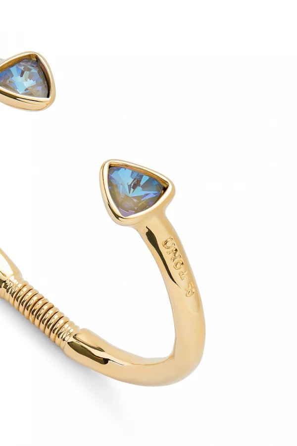 PULSERA RÍGIDA FINA DE ALEACIÓN DE METALES BAÑADA EN ORO 18K CON DOS CRISTALES FACETADOS MULTICOLOR Pulsera
