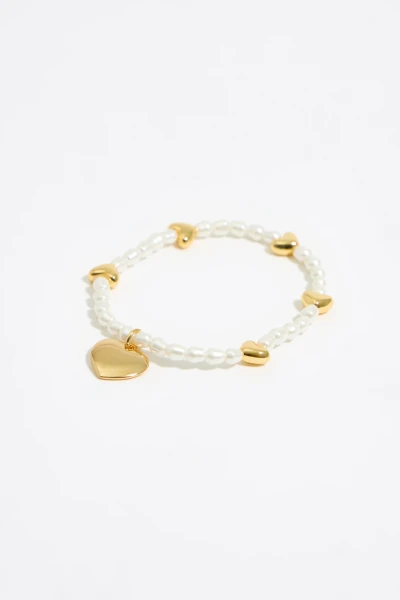 PULSERA ELÁSTICA PERLAS Y CORA Oro
