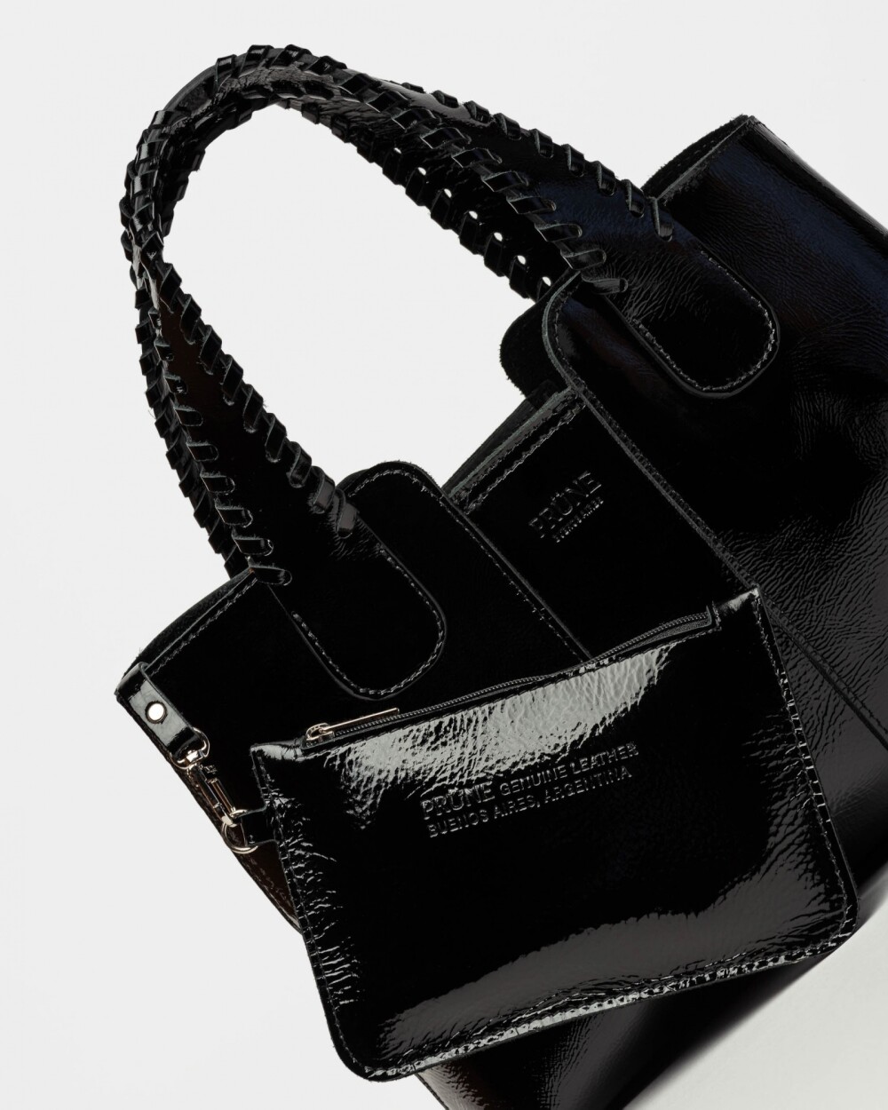 Cartera de mano The Braided en cuero charol arrugado Negro