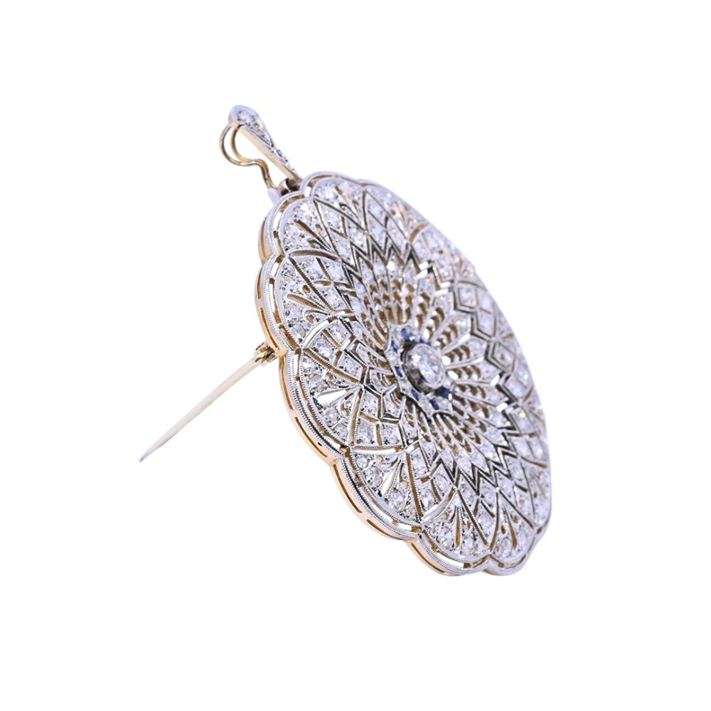 Colgante y prendedor antiguo en oro 18 k, brillantes y zafiros sintéticos. Colgante y prendedor antiguo en oro 18 k, brillantes y zafiros sintéticos.