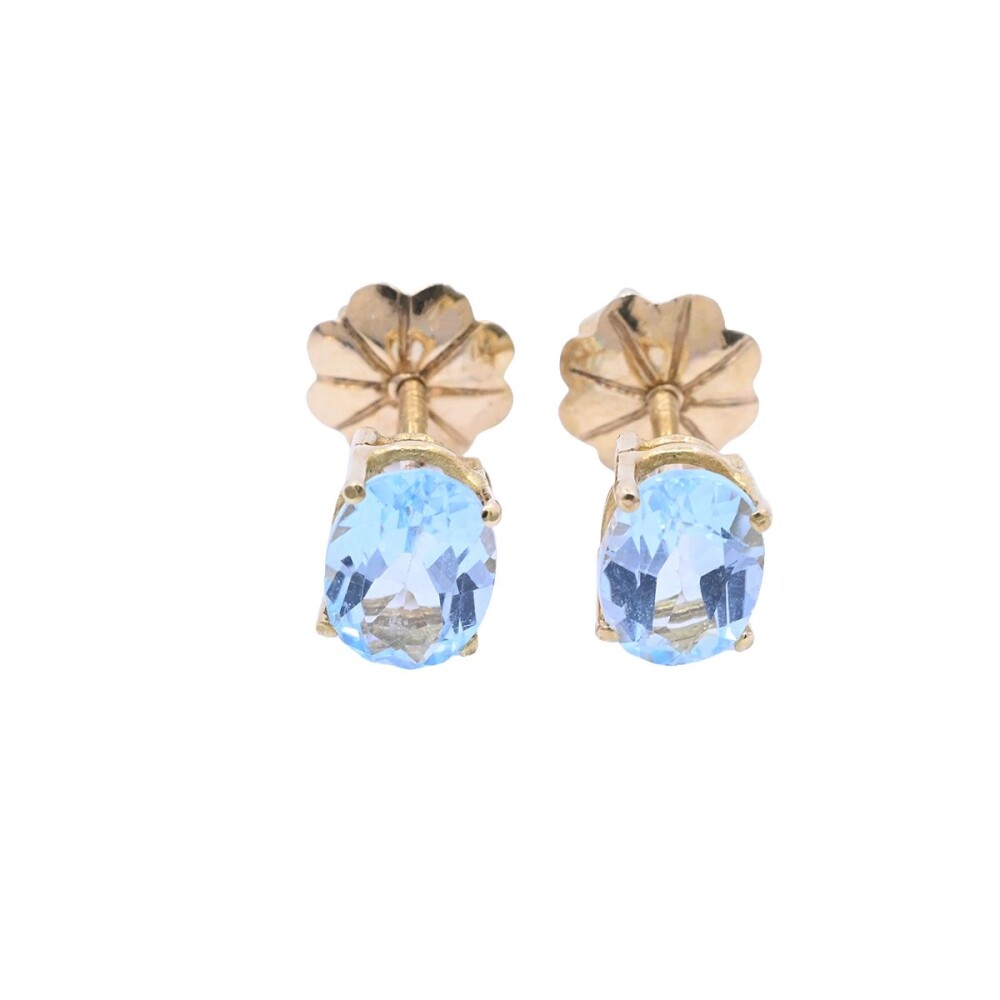 Caravanas oro 18k con topacios celestes oval. Caravanas oro 18k con topacios celestes oval.