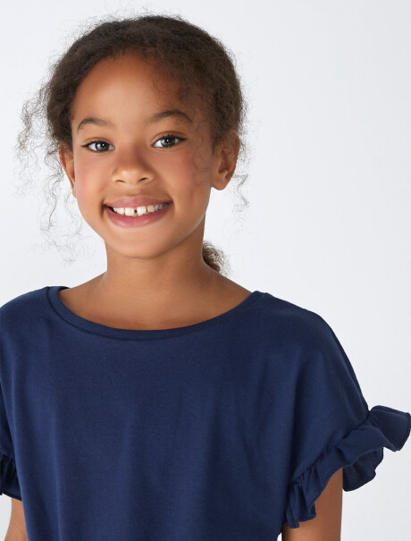 BLUSA DE NIÑA CON VOLADOS Y NUDO AZUL