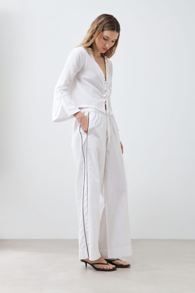 Pantalón de lino con vivo en contraste blanco