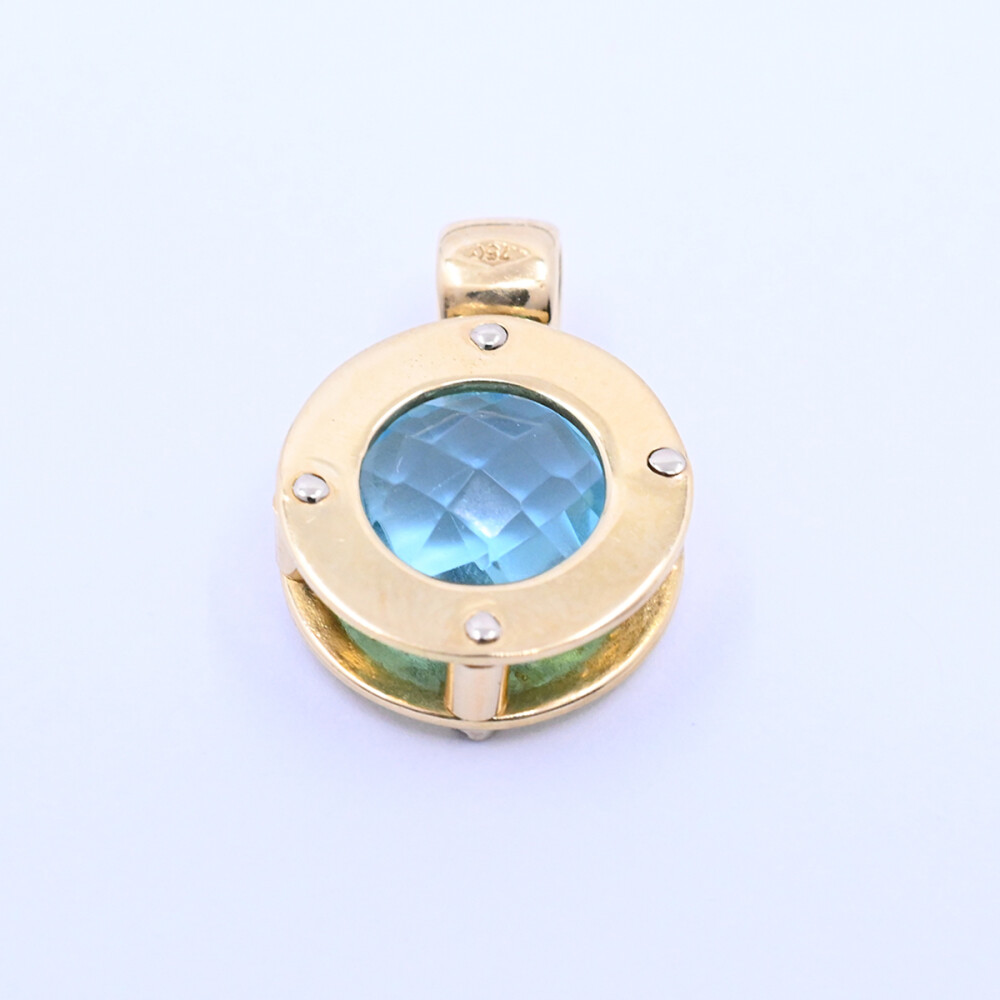 Colgante oro 18k 2 tonos con topacio azul. Colgante oro 18k 2 tonos con topacio azul.