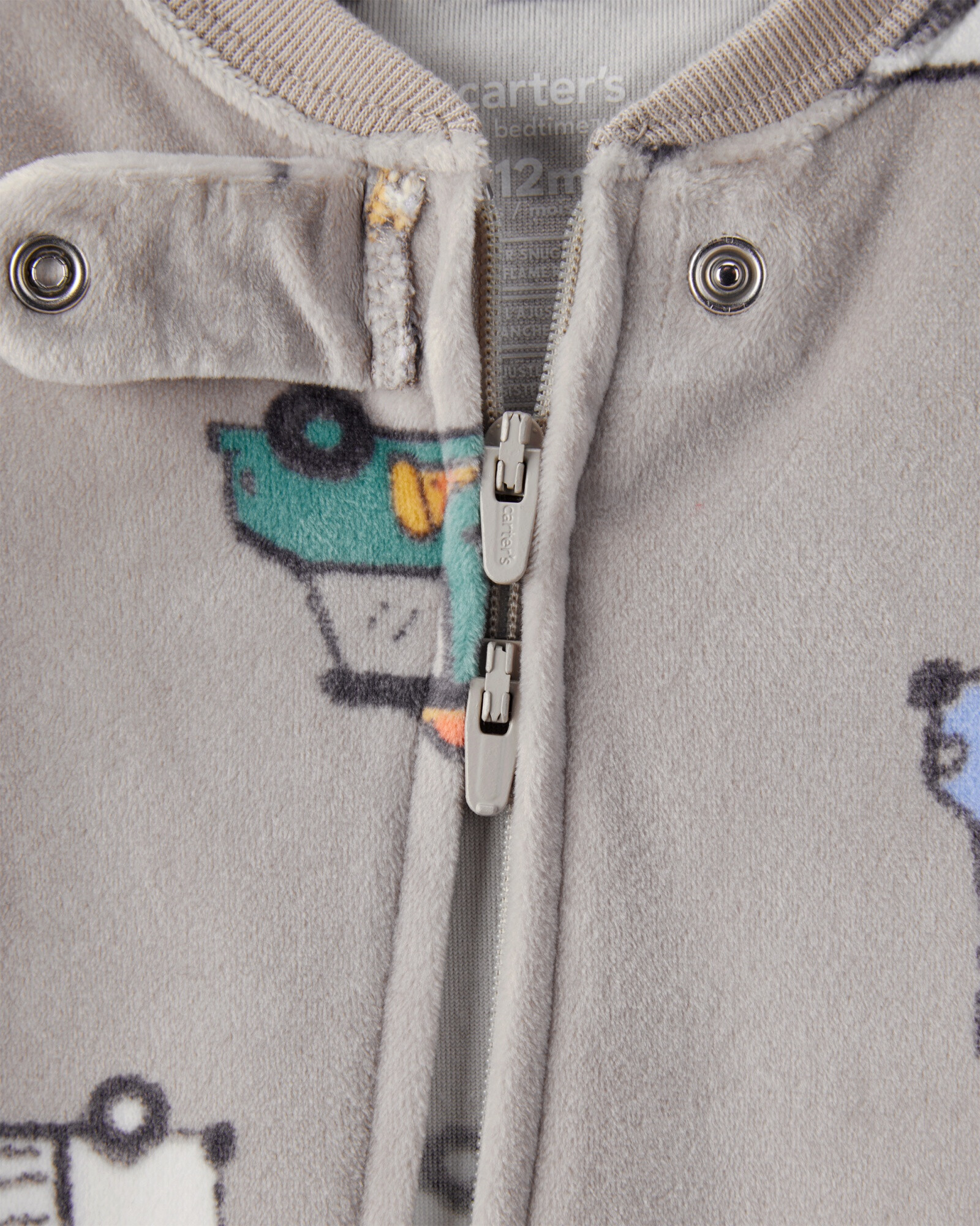Pijama una pieza de micropolar, con pie, diseño camiones de comida Pijama una pieza de micropolar, con pie, diseño camiones de comida