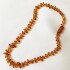 Collar ambar piedra irregular marron