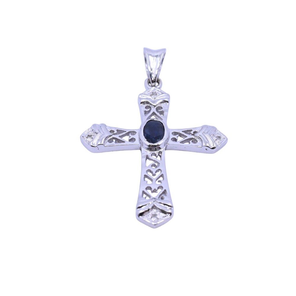 Cruz oro 18k blanco con zafiro oval azul y brillantes. Cruz oro 18k blanco con zafiro oval azul y brillantes.