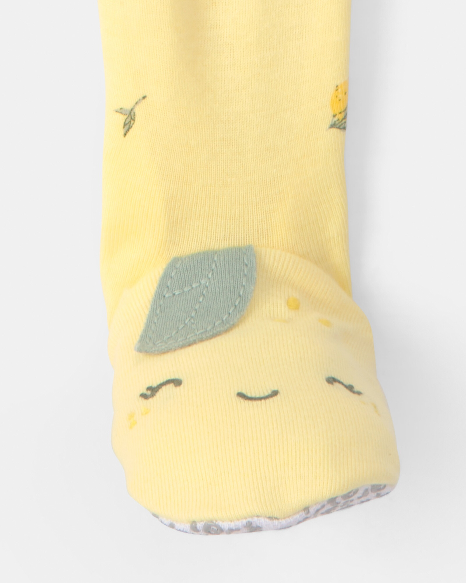 Pijama enterito de algodón con pie, amarillo, diseño limones. Talles 12-24M Pijama enterito de algodón con pie, amarillo, diseño limones. Talles 12-24M
