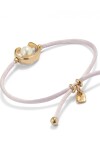 PULSERA DE HILO LILA CON PERLA SHELL FORNITURA BAÑADA EN ORO 18K. Pulsera