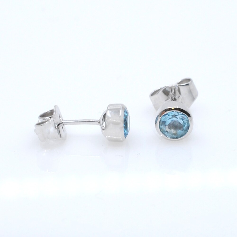 Caravanas oro 18k blanco y topacio celeste Caravanas oro 18k blanco y topacio celeste