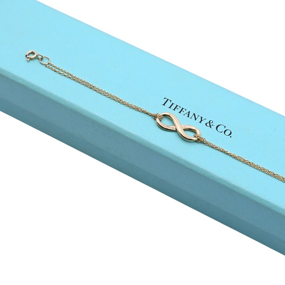 Tiffany & Co. Pulsera infinity oro 18 k amarillo con estuche. Tiffany & Co. Pulsera infinity oro 18 k amarillo con estuche.