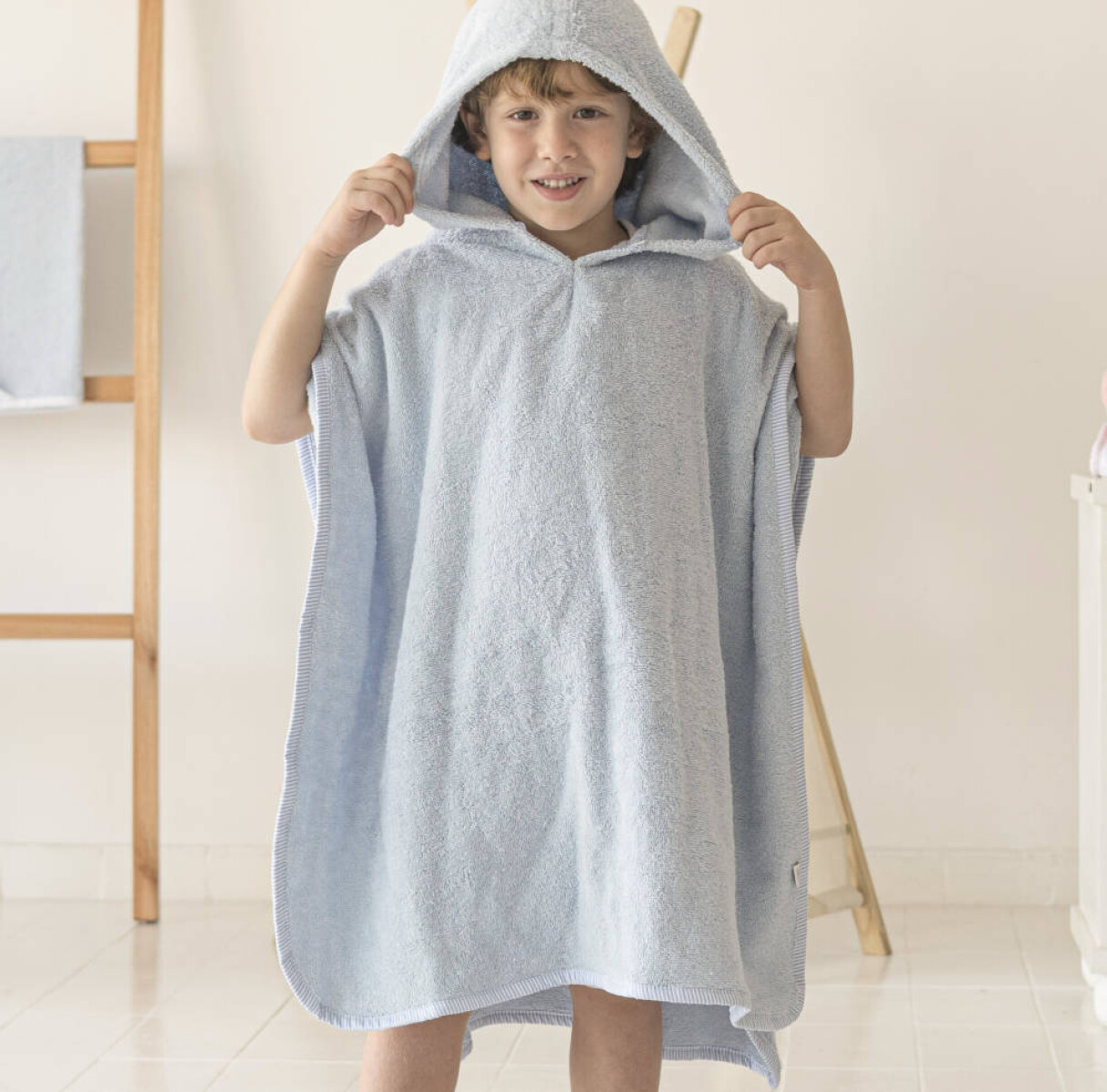 Poncho de toalla celeste con rayas - 1 a 3 años 