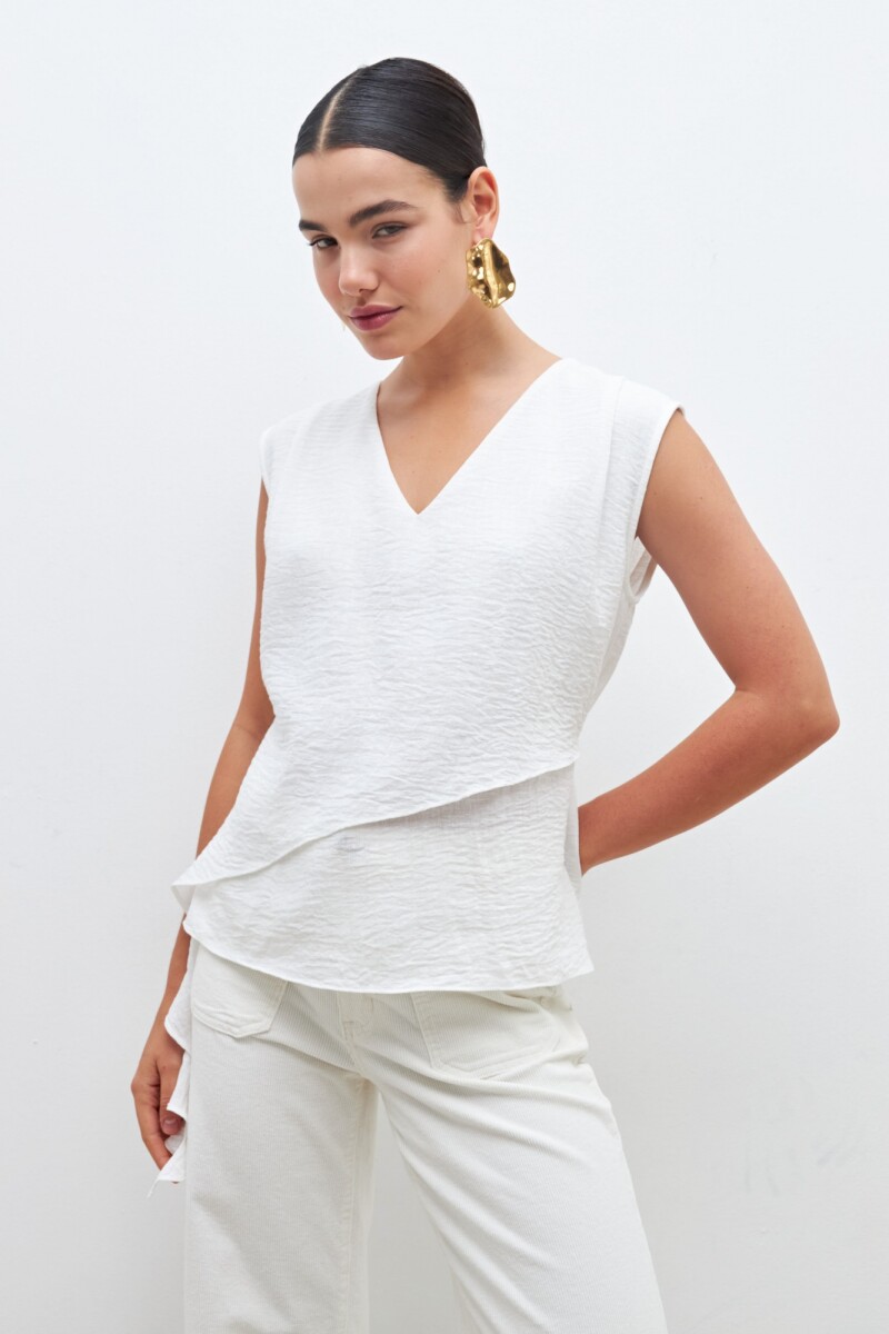Blusa con volado crudo