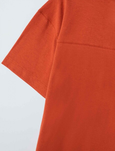 CAMISETA INFANTIL CON BOTONES MODELO OVERSIZE NARANJA