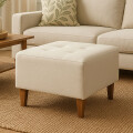 Puff tela y patas de madera Bouclé