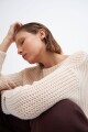 Sweater con bolsillo beige
