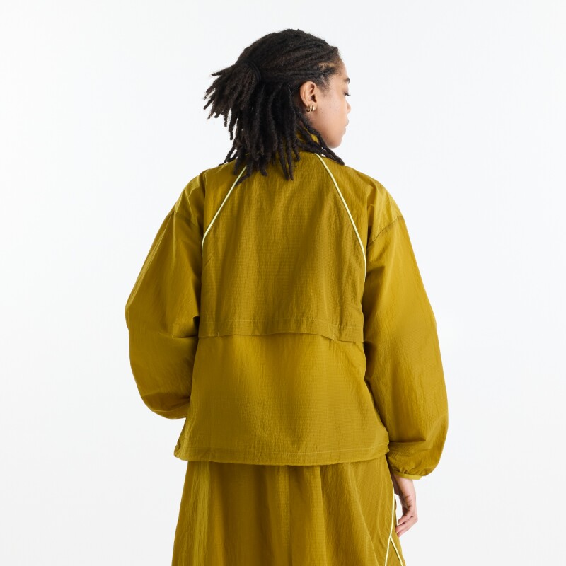 Campera New Balance de Dama - Sport Legacy - WJ6113KSBIL MUSTARD