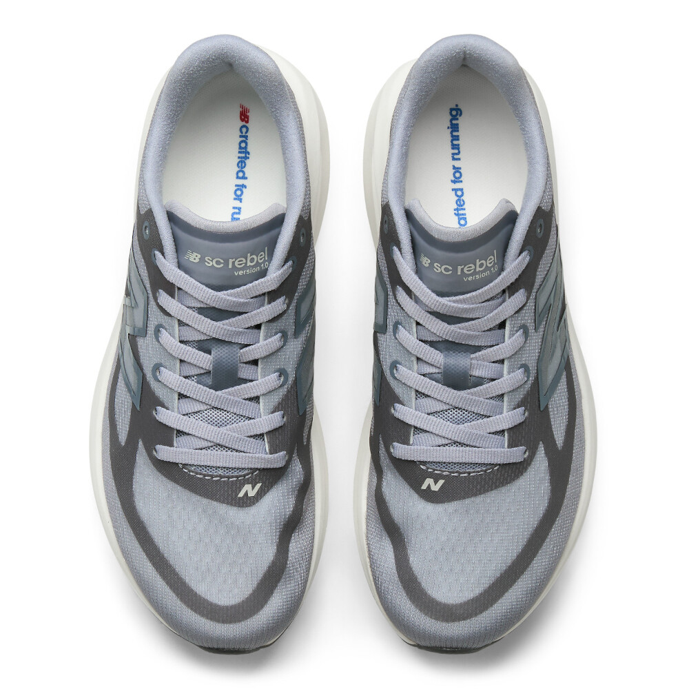 Zapatillas Running Supercomp Rebel V1 Mujer Grey