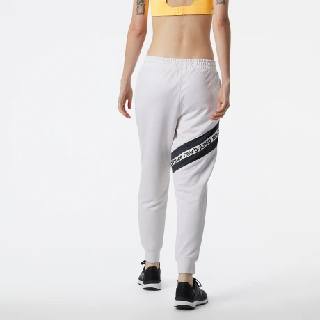 Pantalón New Balance de Dama RELENTLESS TERRY - WP21180SST WHITE