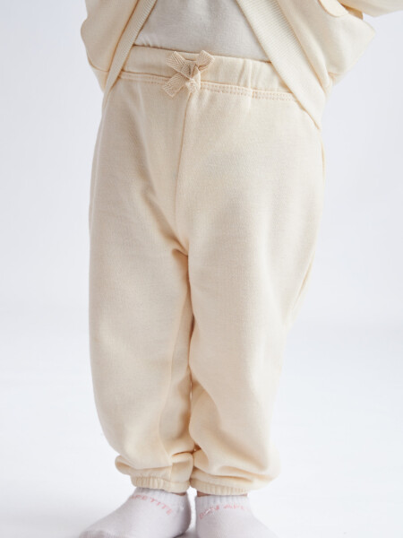 Pantalón deportivo liviano Crema