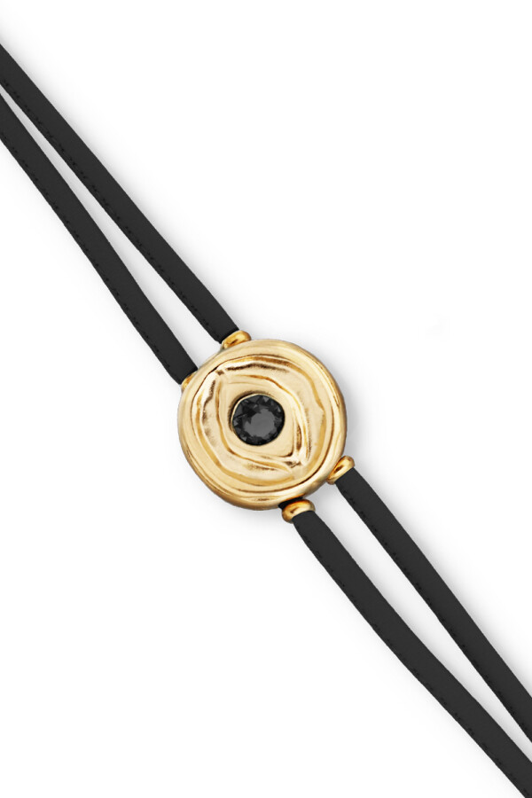 PULSERA DE CUERO DOBLE NEGRO CON DETALLE DE OJO EN ALEACIÓN DE METALES BAÑADO EN ORO 18K Y CRISTAL Pulsera