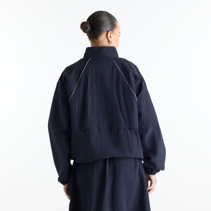 Campera New Balance de Dama - Sport Legacy - WJ6113KSDNT NAVY BLUE
