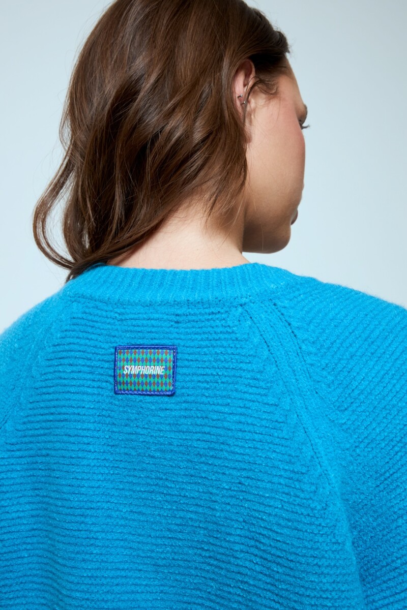 Cardigan corto con cierre celeste