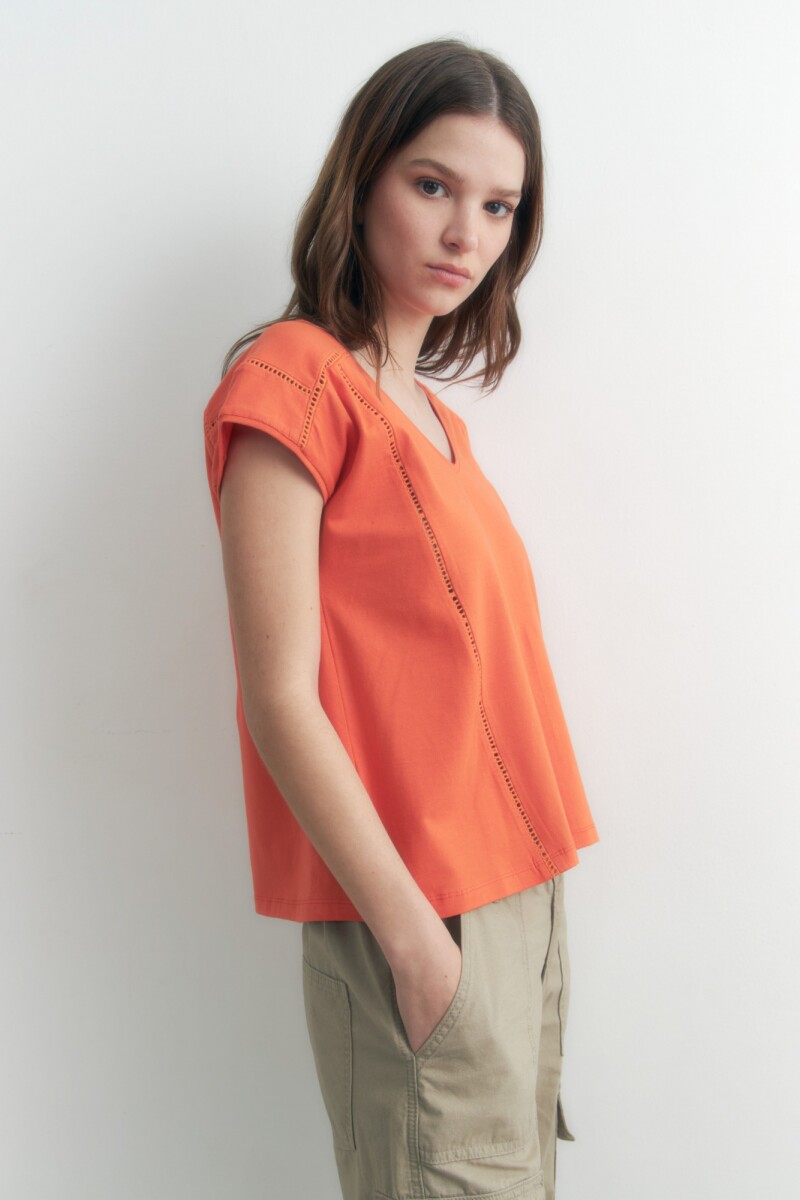 Remera con vainillas naranja