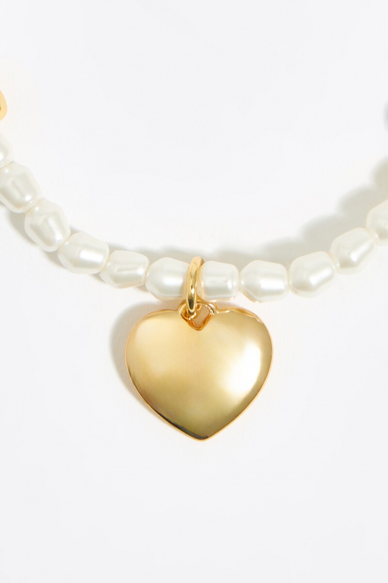 PULSERA ELÁSTICA PERLAS Y CORA Oro