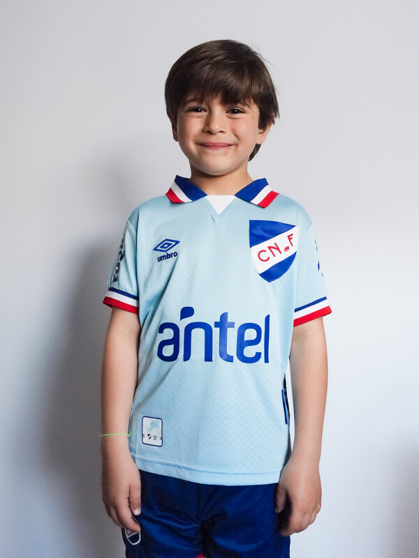 CAMISETA DE JUEGO OFICIAL AWAY 3 Nacional Junior Skuba, Celeste