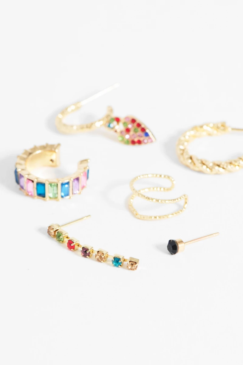 Set de seis aros y earcuff strass dorado