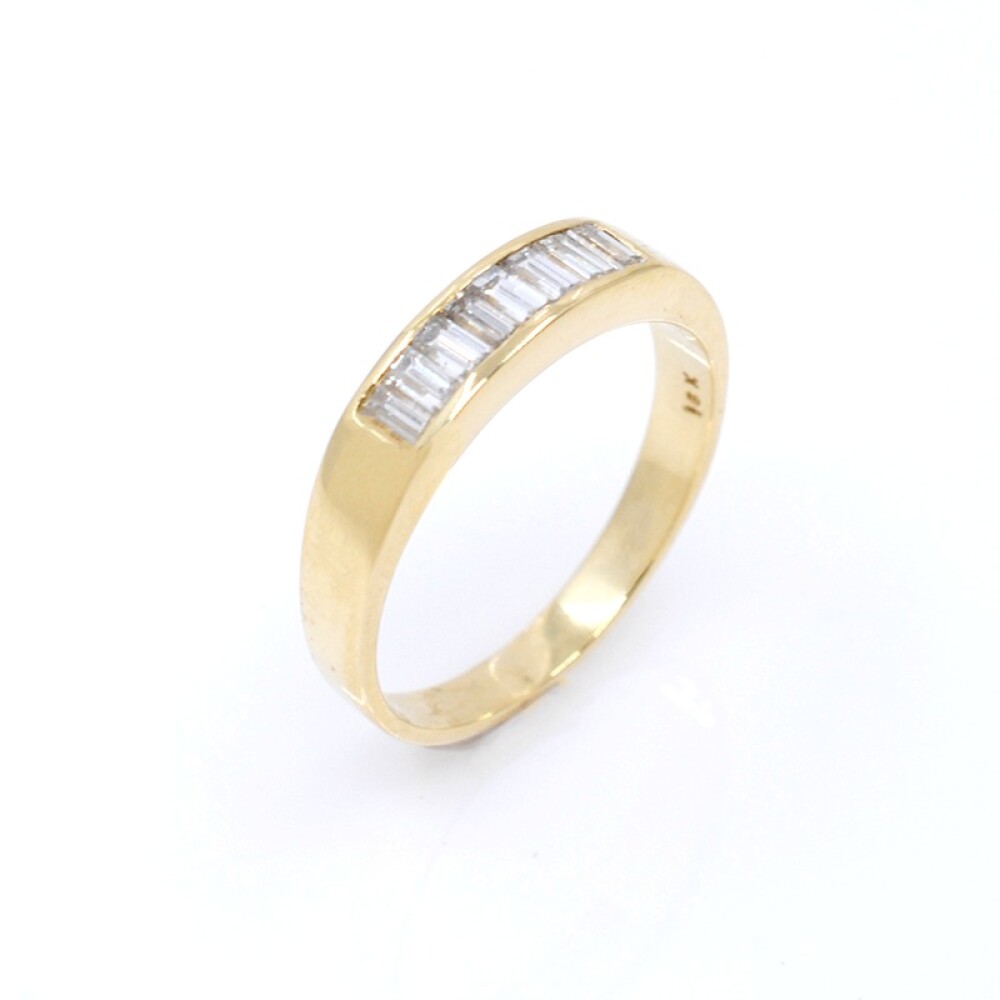 Anillo medio sin fin en oro 18k y brillantes baguettes Anillo medio sin fin en oro 18k y brillantes baguettes