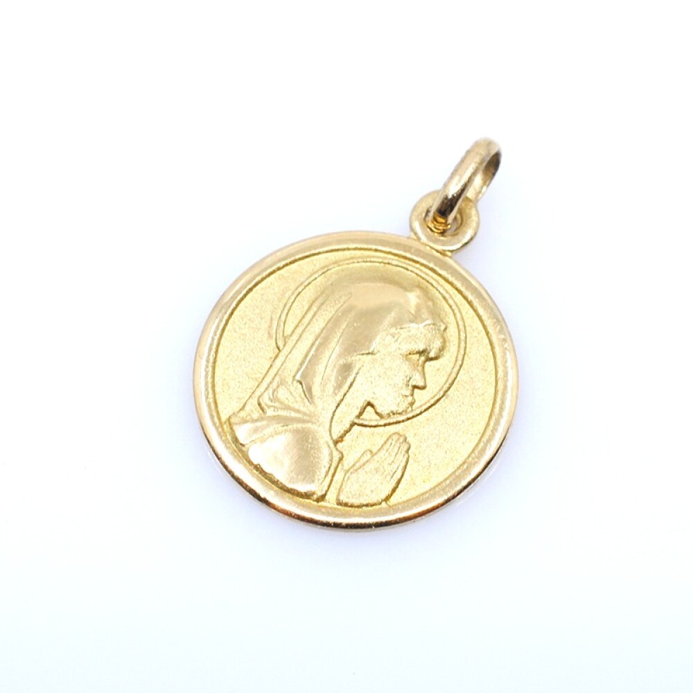 Medalla en oro 18k amarillo con imagen religiosa. Diámetro 14mm Medalla en oro 18k amarillo con imagen religiosa. Diámetro 14mm