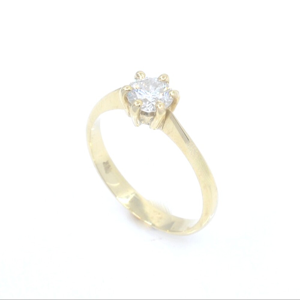 Anillo solitario en oro 18k y brillante con engarce de 6 puntas Anillo solitario en oro 18k y brillante con engarce de 6 puntas