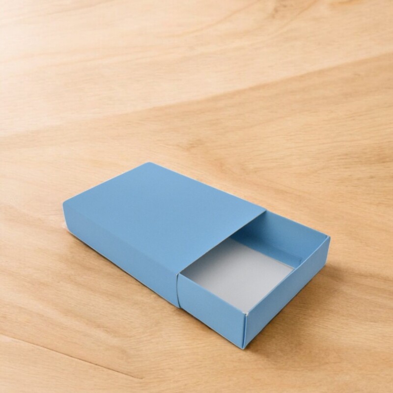Caja 13 tipo caja fosforo 10x14x3 cm. CELESTE
