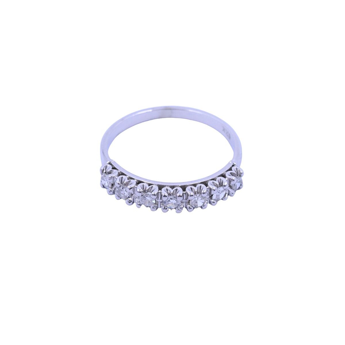 Anillo medio sin fin oro 18k blanco con 7 brillantes engarce 4 puntas. 