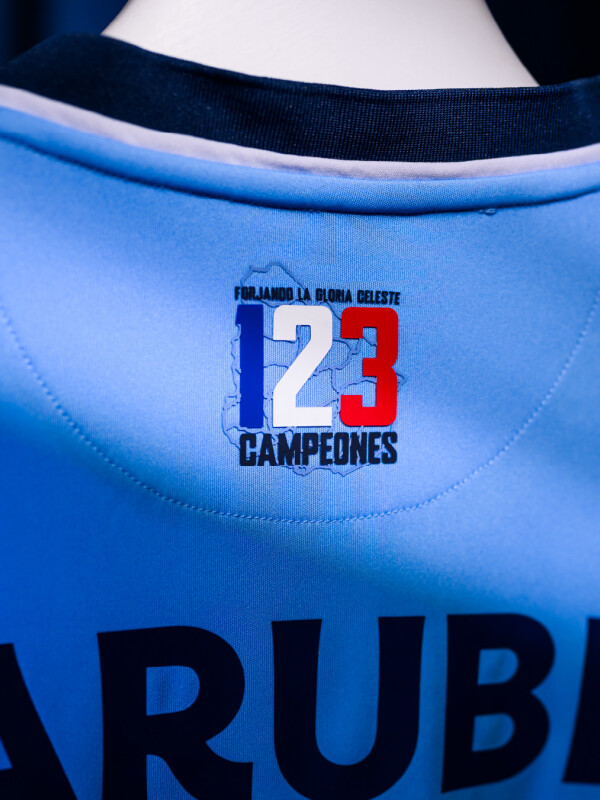 CAMISETA CELESTE EDICION 2026 Nacional Junior Skuba, Celeste