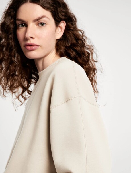 BUZO CON PUÑOS ELASTIZADOS BEIGE