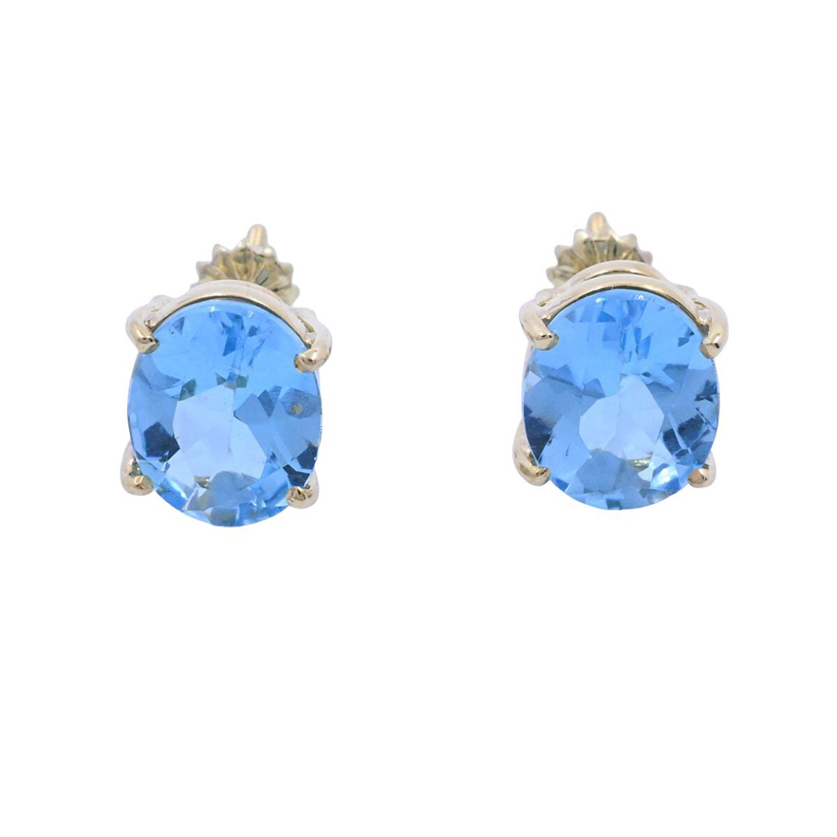 Caravanas oro 18k con topacios azules oval engarce 4 puntas. 