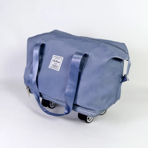 BOLSO AZUL P/VIAJE C/RUEDITAS 39X20X34CM Unica