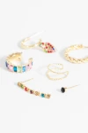 Set de seis aros y earcuff strass dorado