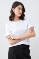 Remera con botón metálico en puños blanco