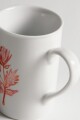 Taza terracota en flor