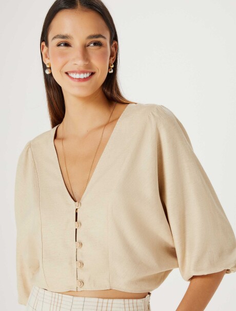BLUSA CON MANGAS ABULLONADAS BEIGE