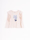 REMERA FLEURS BEIGE CLARO
