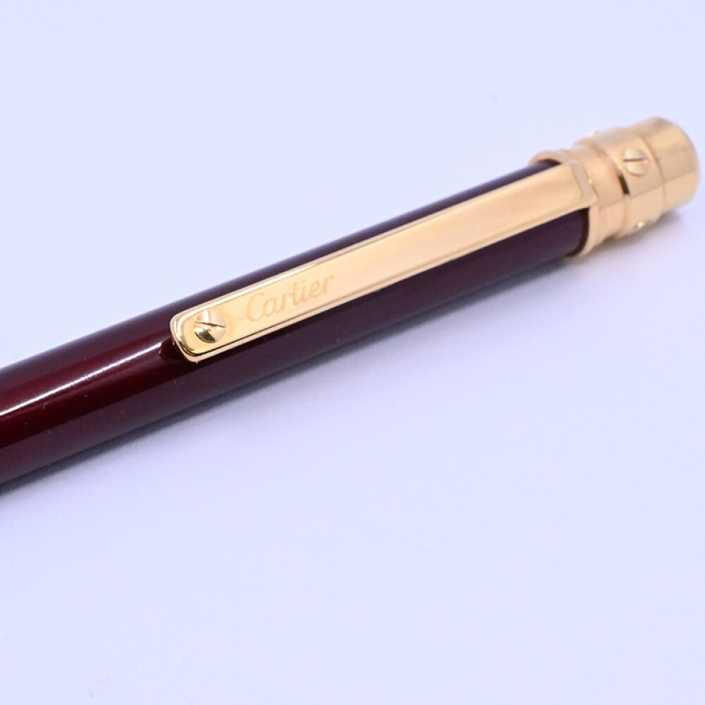 Lapicera Cartier Santos ST150190 Cuerpo bordeau año 2017 con estuche y papeles. Lapicera Cartier Santos ST150190 Cuerpo bordeau año 2017 con estuche y papeles.