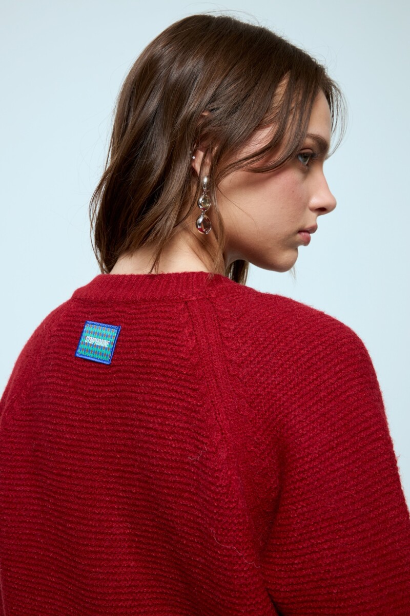 Cardigan corto con cierre rojo