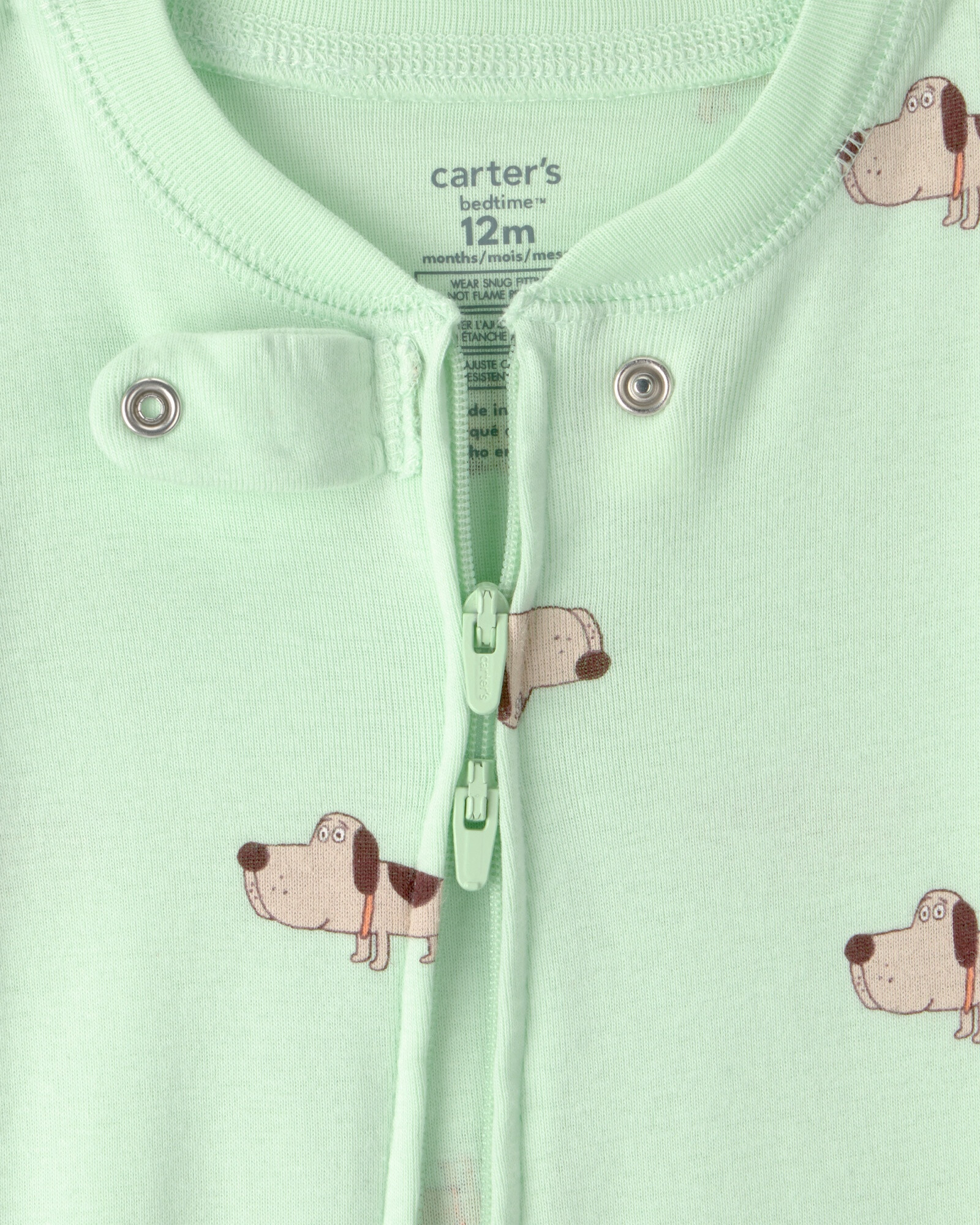 Pijama enterito de algodón con pie, verde, diseño perros. Talles 12-24M Sin color